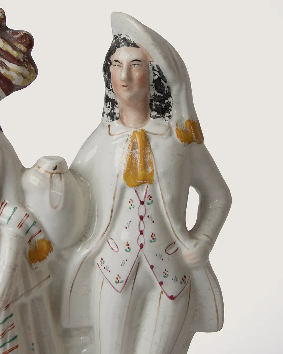 close-up detail of
hand-painted glaze and
authentic historic crazing on
staffordshire figurine