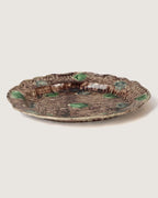 editorial view of 19th-century
majolica pottery styled in an
architectural digest aesthetic
