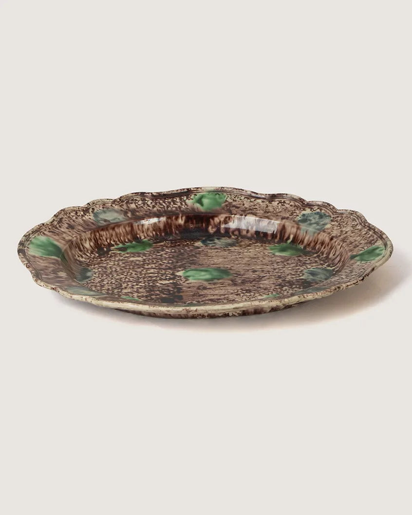 editorial view of 19th-century
majolica pottery styled in an
architectural digest aesthetic