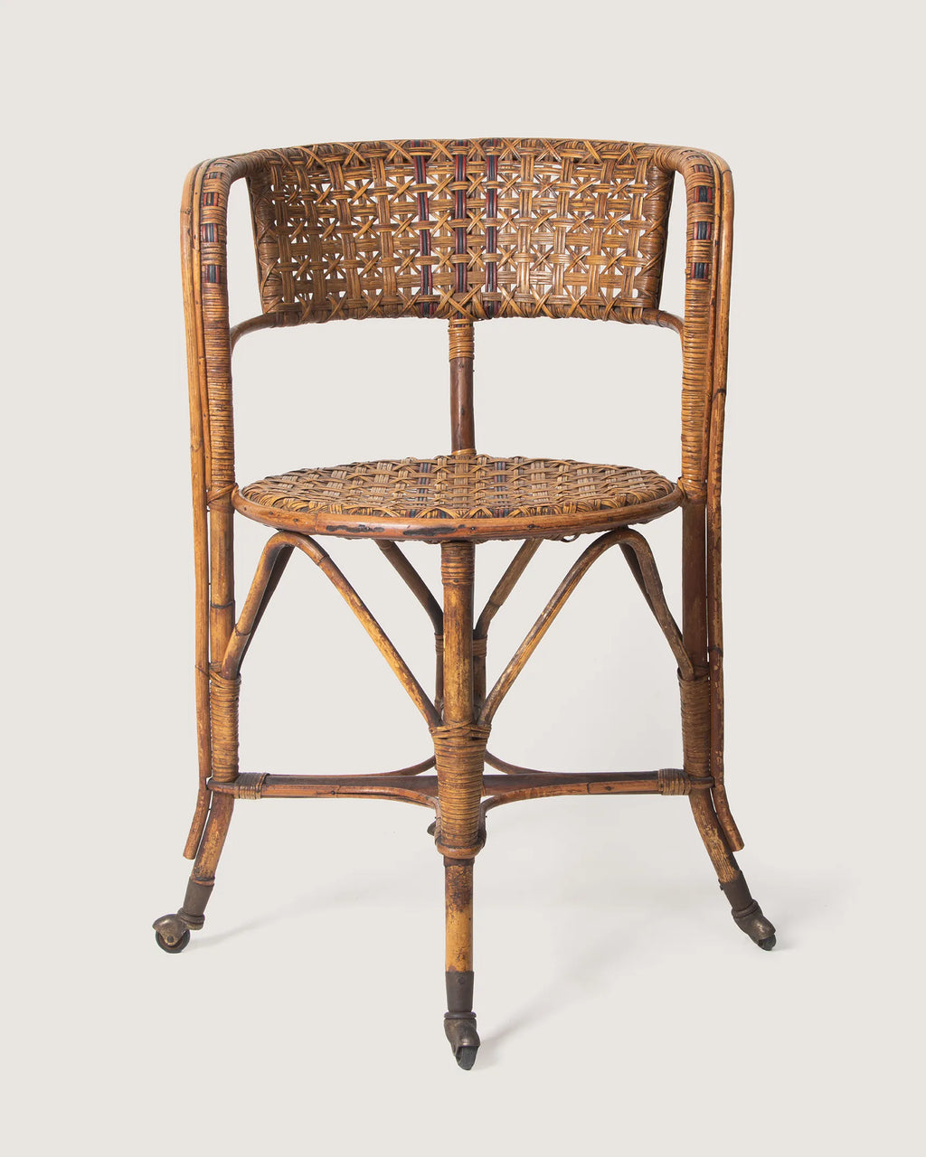 Early 20th-century antique Italian wicker and rattan armchair on castors, made by Dal Vera Milano.