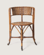 Early 20th-century antique Italian wicker and rattan armchair on castors, made by Dal Vera Milano.
