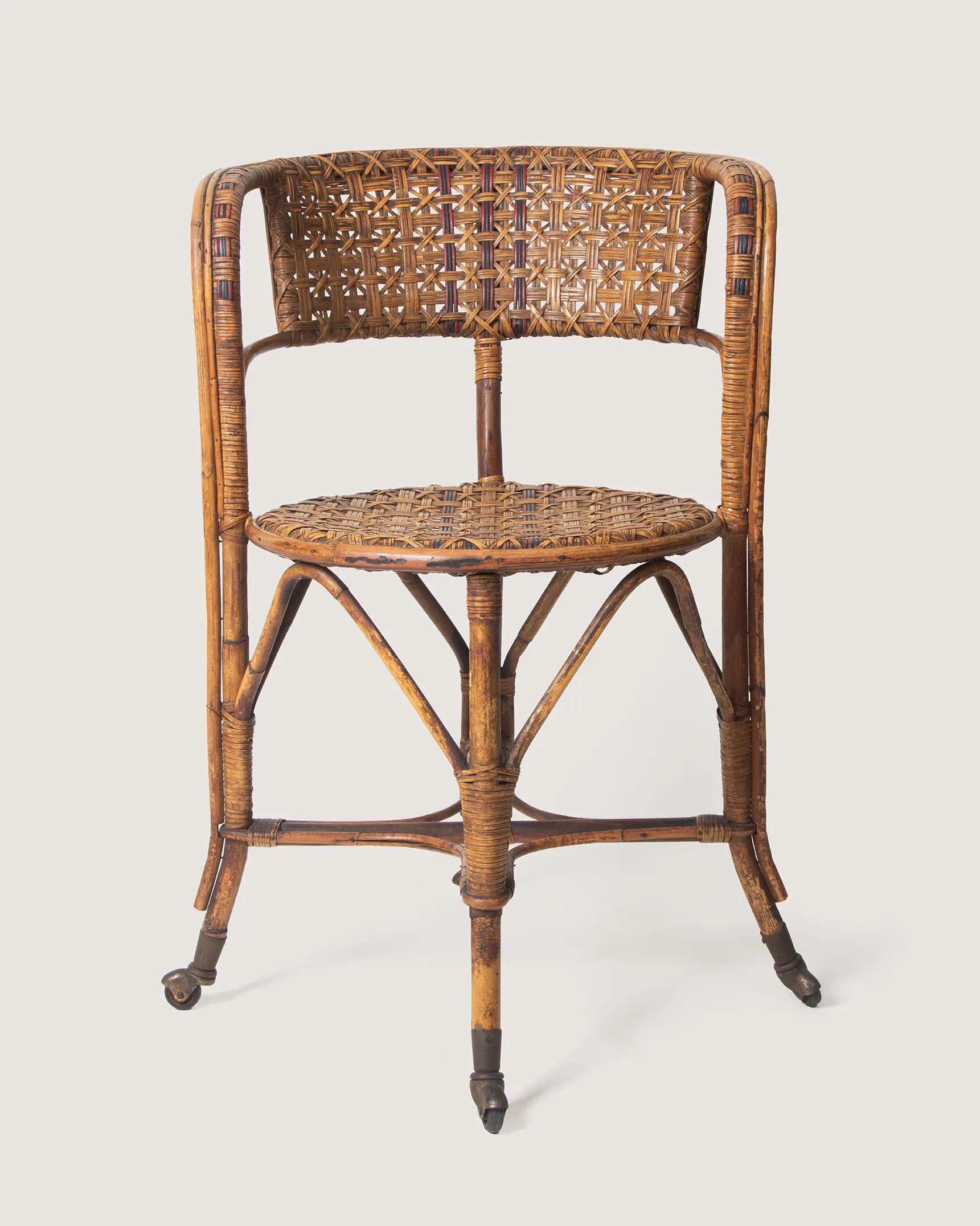 Early 20th-century antique Italian wicker and rattan armchair on castors, made by Dal Vera Milano.
