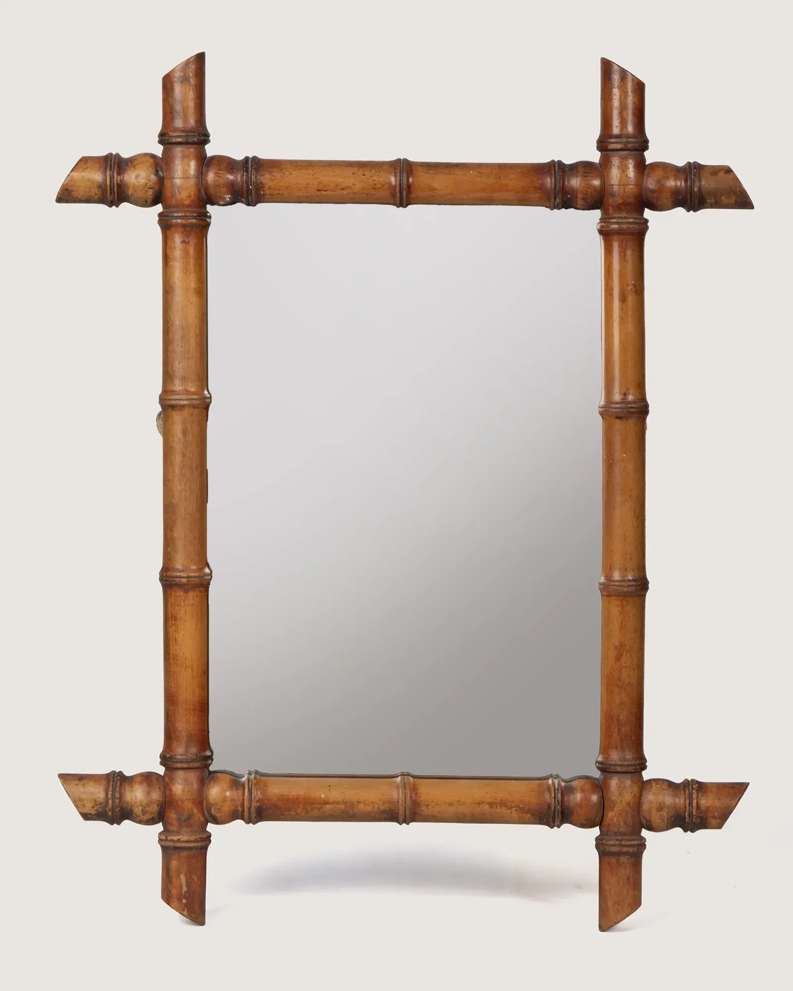 Full front view of the 44 x 56 cm antique French faux bamboo mirror, showcasing its rustic cane-cut corners and warm honey wood tone against a white background.