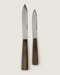 Early 20th-century antique French 16-piece JDA Inox flatware knife set featuring polished dark horn handles.