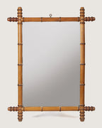 Full front independent view of the 60 x 78 cm antique French faux bamboo mirror with its original top hanging ring against a white backdrop.