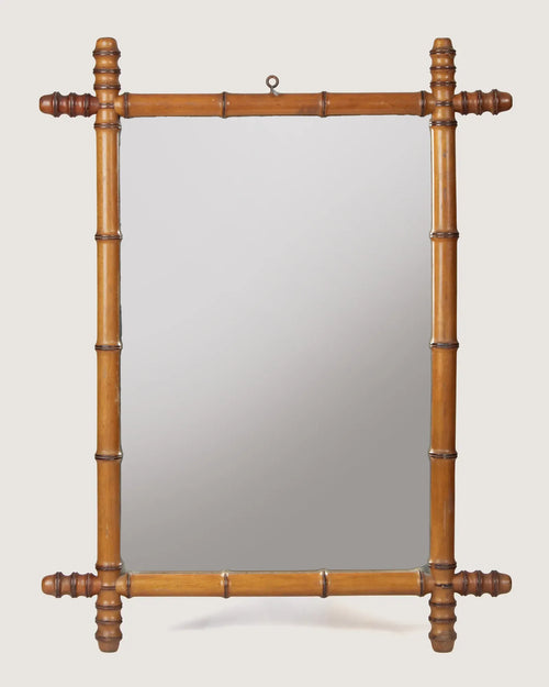 Full front independent view of the 60 x 78 cm antique French faux bamboo mirror with its original top hanging ring against a white backdrop.