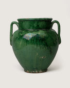 Vintage early 20th-century French terracotta confit pot coated in a vibrant, glossy green glaze.