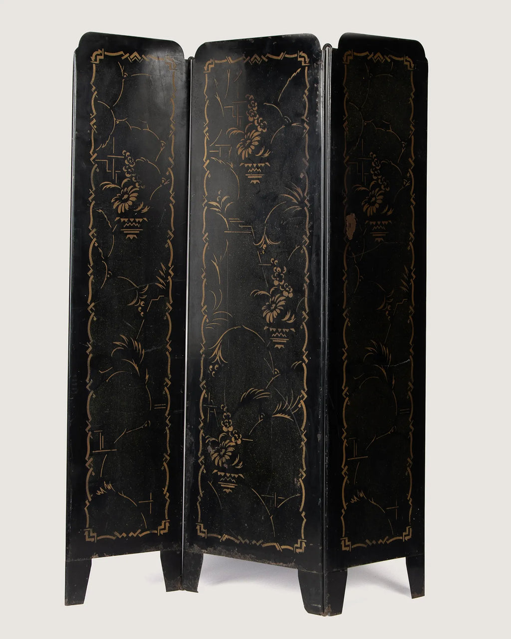 Full front view of the antique Italian lacquered metal radiator screen fully standing, highlighting the three folding panels decorated with gold orientalist graphics.