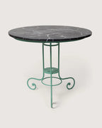 Antique early 20th-century Italian garden table with a green wrought iron frame and a hand-painted trompe-l'œil faux marble top. One-of-a-kind vintage garden decor curated by Atelier Bellinzona.
