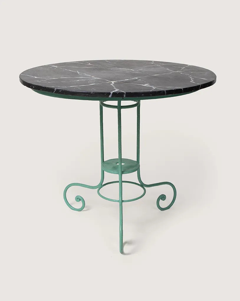 Antique early 20th-century Italian garden table with a green wrought iron frame and a hand-painted trompe-l'œil faux marble top. One-of-a-kind vintage garden decor curated by Atelier Bellinzona.