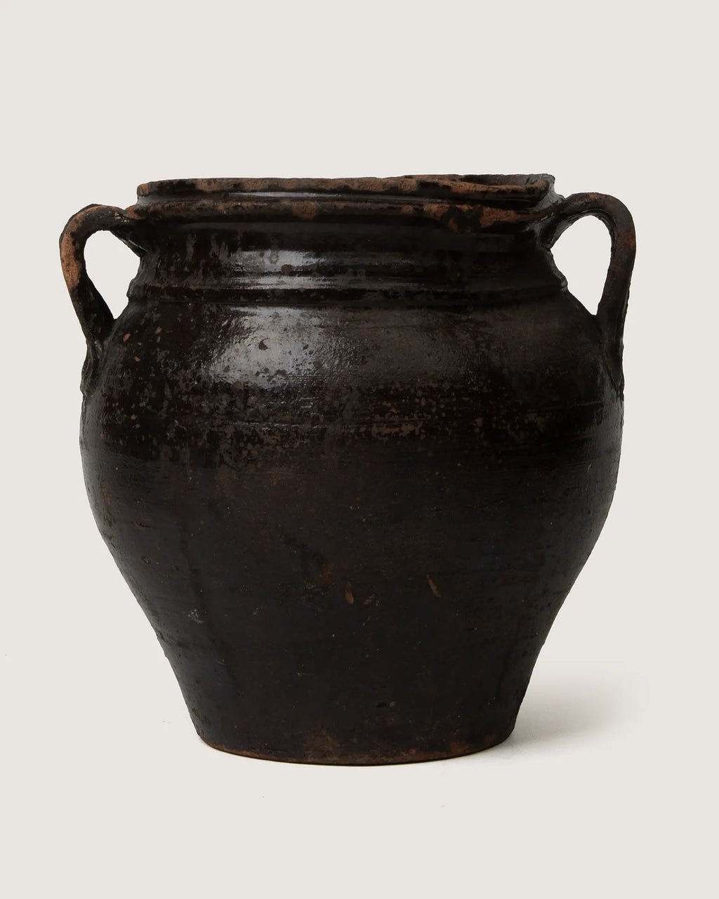 Unique early 20th-century Piedmontese terracotta confit pot with a rare, characterful lopsided handmade silhouette.