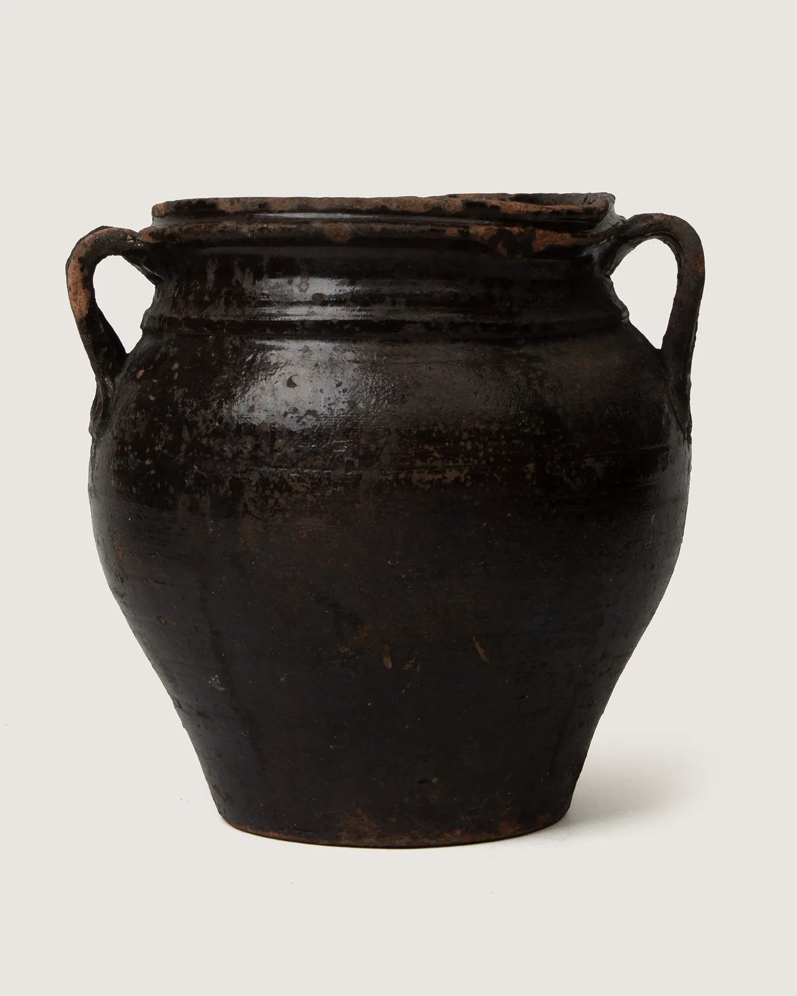 Unique early 20th-century Piedmontese terracotta confit pot with a rare, characterful lopsided handmade silhouette.