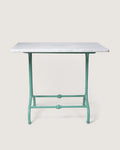 Antique late 19th-century outdoor bistro table featuring an ornate mint green cast iron base and a circular white marble top. One-of-a-kind vintage garden decor curated by Atelier Bellinzona.