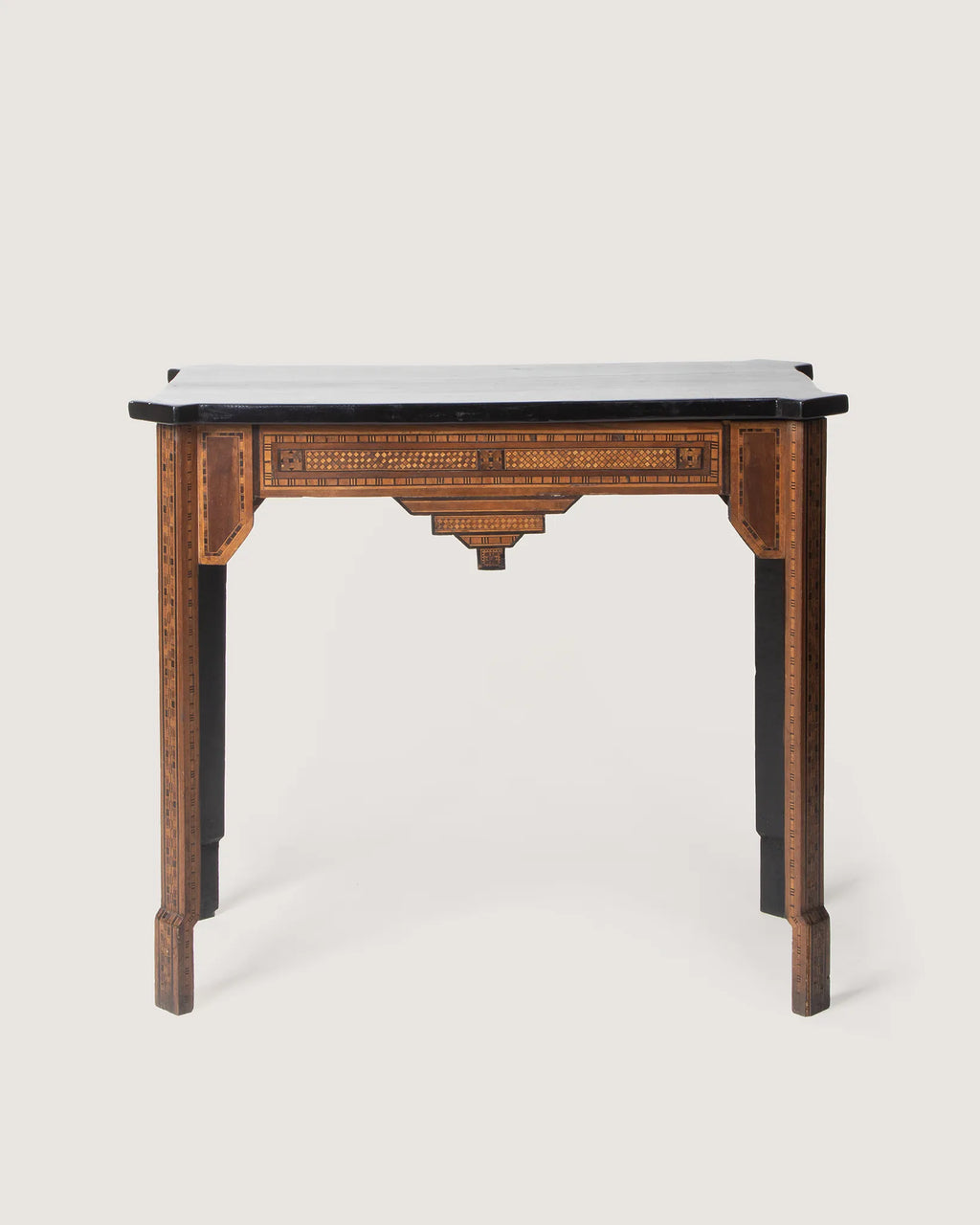 Antique Moorish-style console table featuring intricate geometric wood marquetry and a contrasting ebonized top.