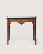 Antique Moorish-style console table featuring intricate geometric wood marquetry and a contrasting ebonized top.