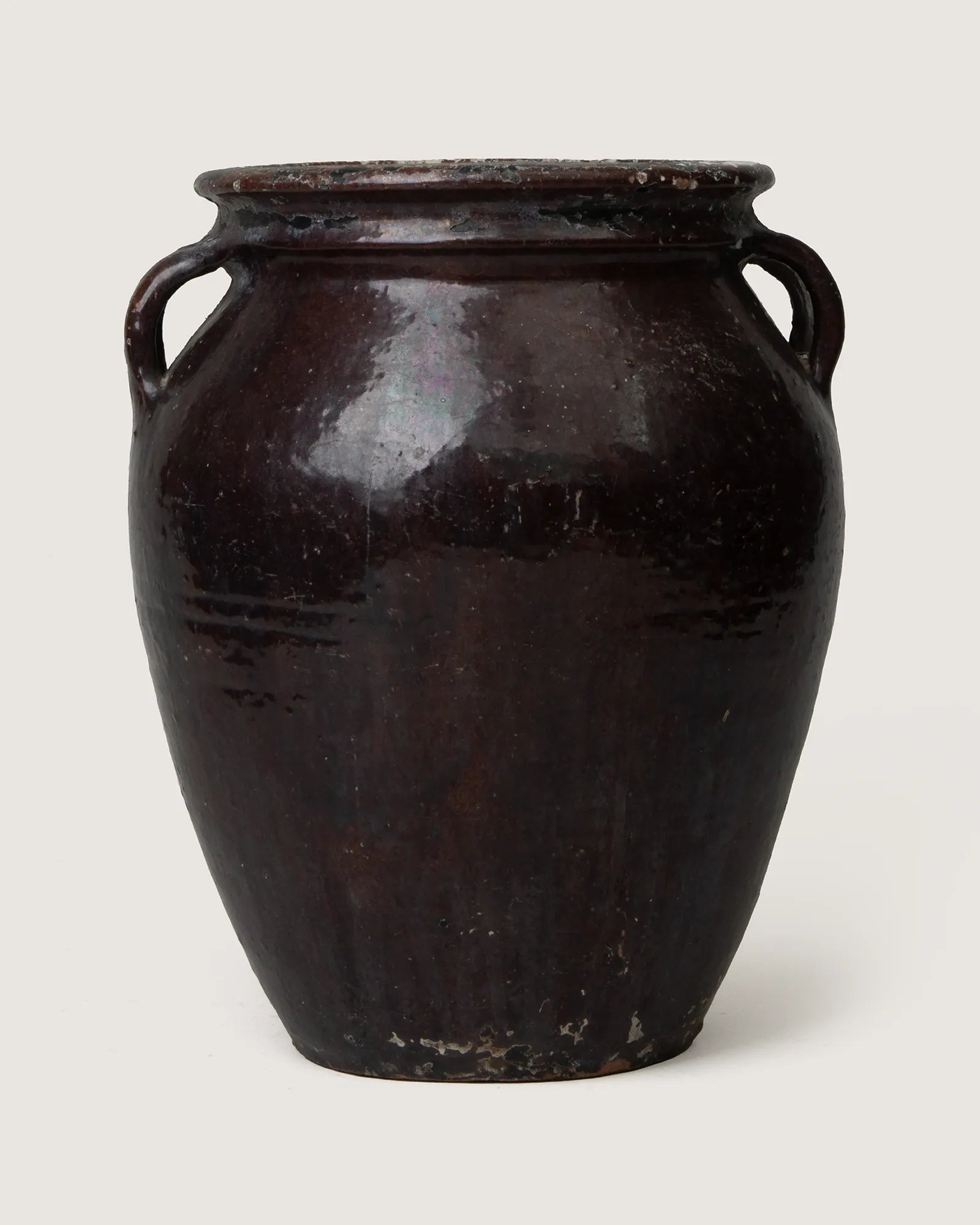 Authentic early 20th-century Piedmontese terracotta pot featuring a heavily weathered and worn painted surface.