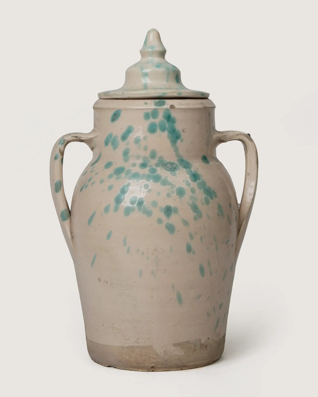 Rare early 20th-century terracotta storage jar with its original lid from Central Italy, finished in a rustic splatterware glaze.