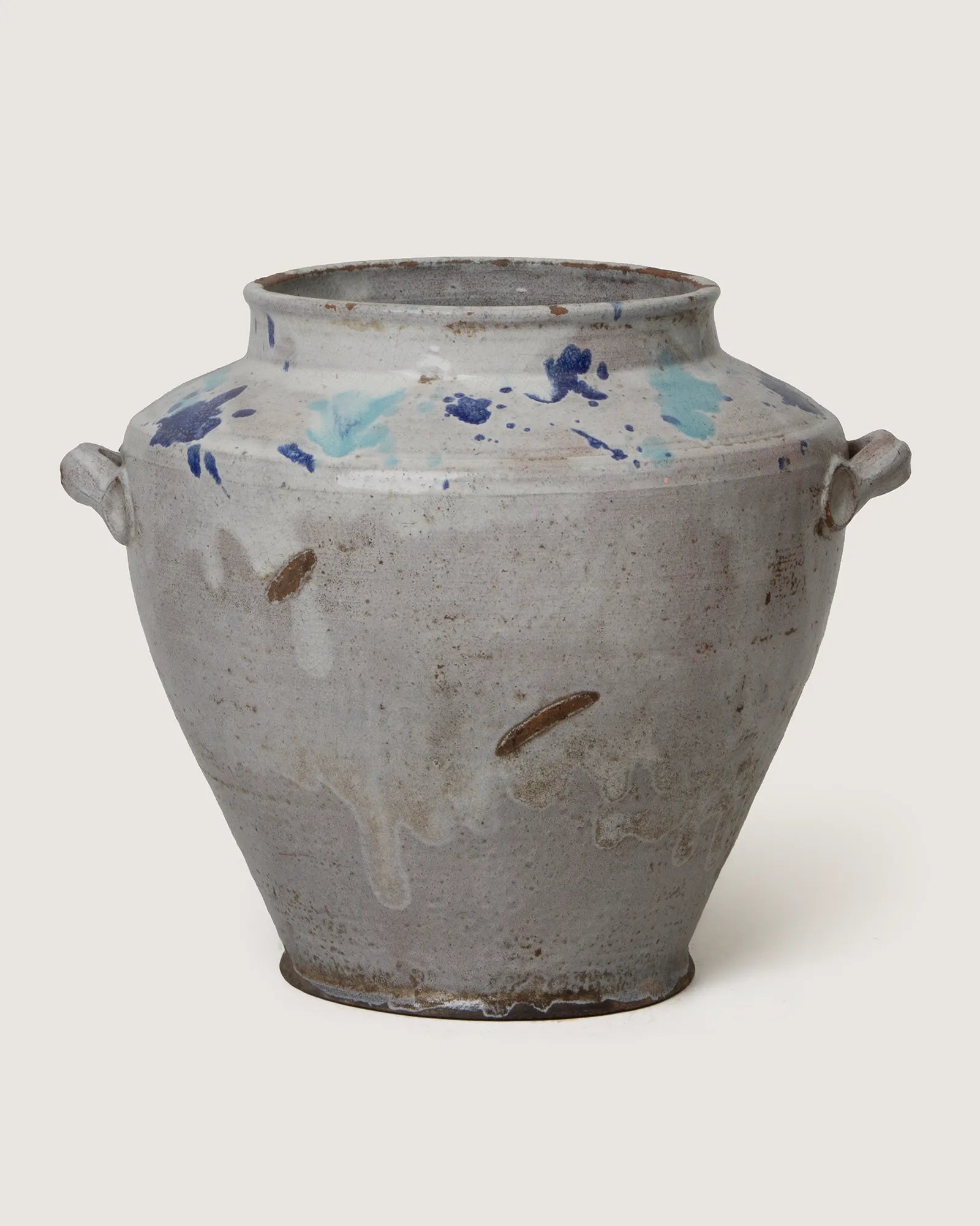 Charming early 20th-century squat terracotta pot from Central Italy featuring rare blue splatterware accents.