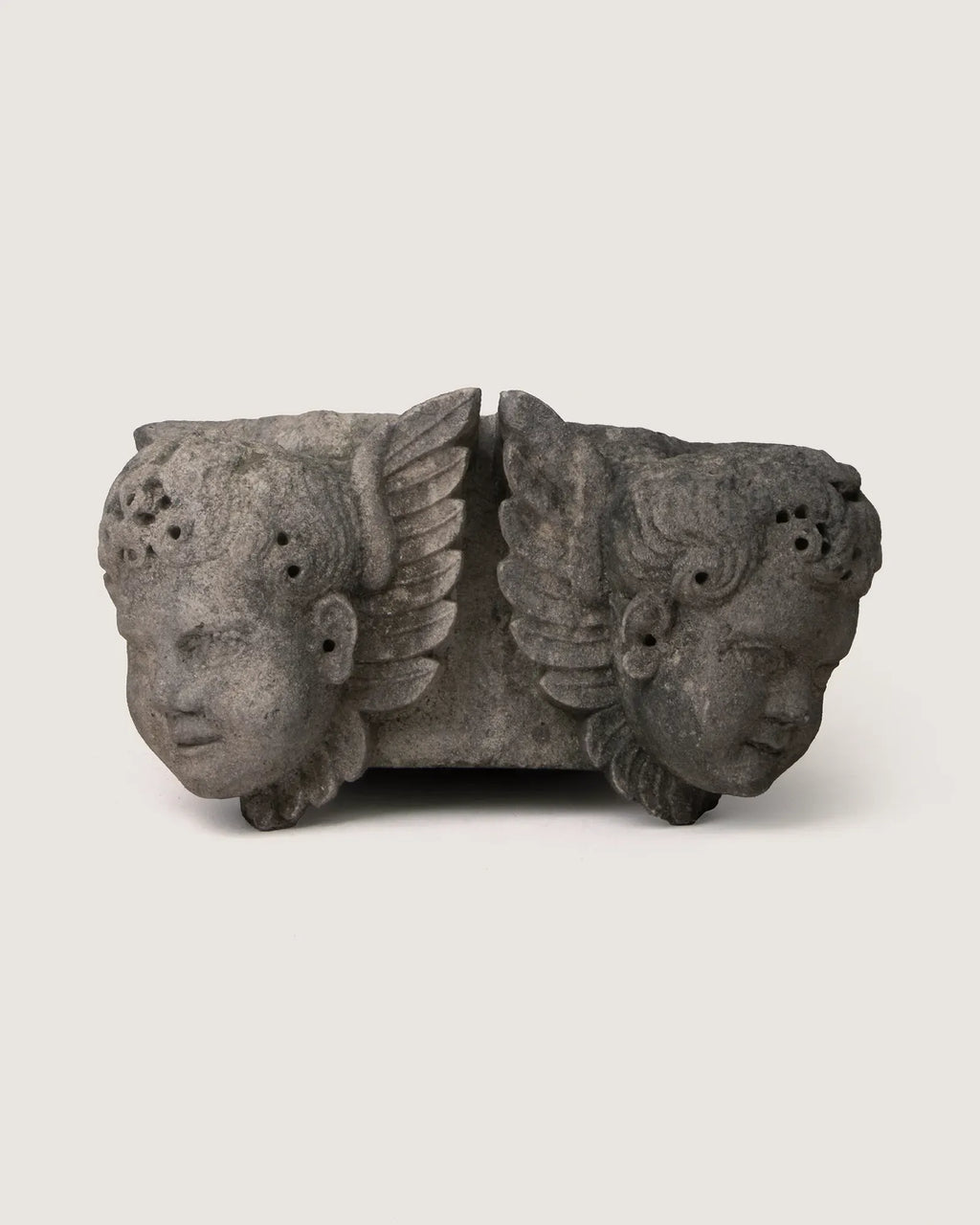 Rare early 20th-century stone and concrete architectural element sculpted with two detailed cherub figures.