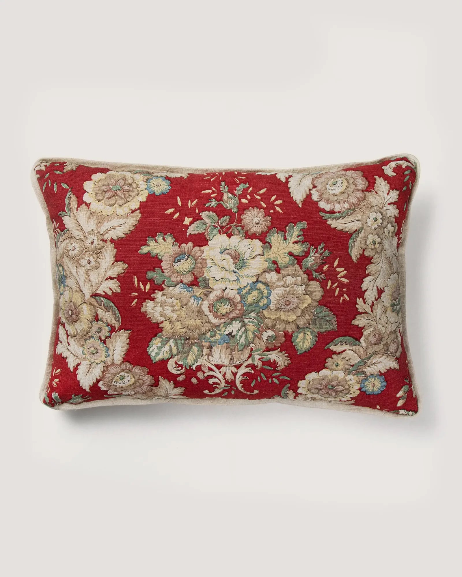 Full front view of a rectangular 56x26 cm lumbar cushion showcasing a symmetrical neoclassical floral bouquet pattern on a vibrant red background.