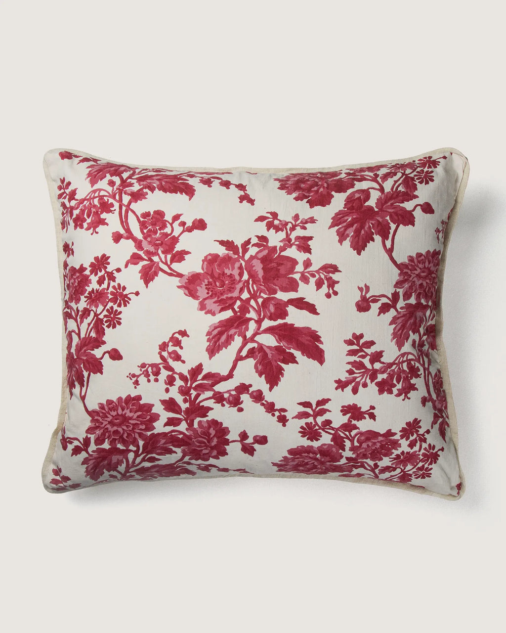 Full front view of a large 58x50 cm square cushion featuring a raspberry red monochrome botanical Toile de Jouy pattern on a cream background.