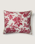 Full front view of a large 58x50 cm square cushion featuring a raspberry red monochrome botanical Toile de Jouy pattern on a cream background.