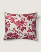 Full front view of a large 58x50 cm square cushion featuring a raspberry red monochrome botanical Toile de Jouy pattern on a cream background.