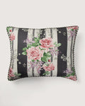 Full front view of a 52x42 cm rectangular cushion in vintage Sanderson cotton, showcasing large pink roses and purple lilacs printed over wide black and white vertical bands.