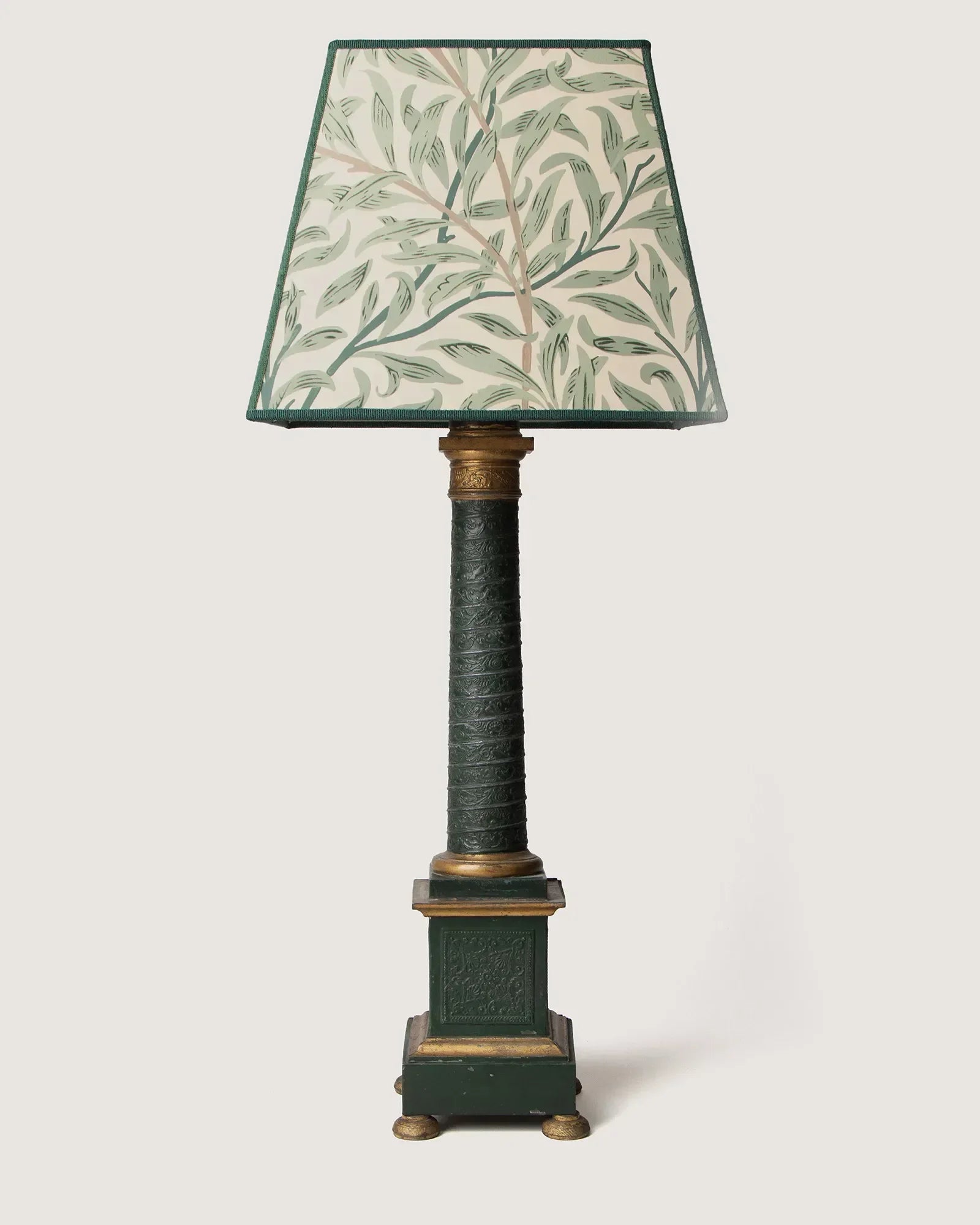 Sophisticated Empire style green tôle column table lamp finished with a heritage William Morris Willow Boughs fabric shade.