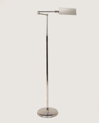 Italian mid-century modern adjustable pharmacy style floor lamp in sleek, polished chrome with a minimalist design. One-of-a-kind vintage lighting curated by Atelier Bellinzona.