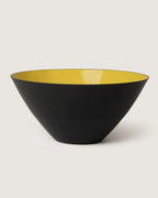 Sleek 1950s mid-century modern enameled metal bowl in a bold black and yellow colorway.