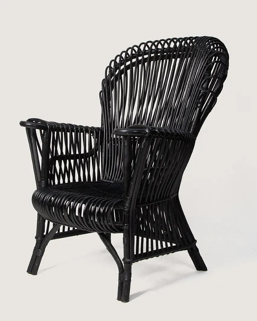 Mid-century modern Italian armchair crafted from black lacquered rattan and bamboo with a minimal, graphic silhouette. One-of-a-kind vintage seating curated by Atelier Bellinzona.
