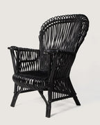 Mid-century modern Italian armchair crafted from black lacquered rattan and bamboo with a minimal, graphic silhouette. One-of-a-kind vintage seating curated by Atelier Bellinzona.