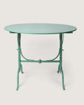 Mid-century 1950s Italian round folding garden bistro table in a striking mint green lacquered iron finish. One-of-a-kind vintage garden decor curated by Atelier Bellinzona.