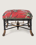 "The Emperor’s Tropical Dream" – an antique French Napoleon III faux bamboo ottoman upholstered in a rich 1950s tropical textile. One-of-a-kind vintage furniture curated by Atelier Bellinzona.