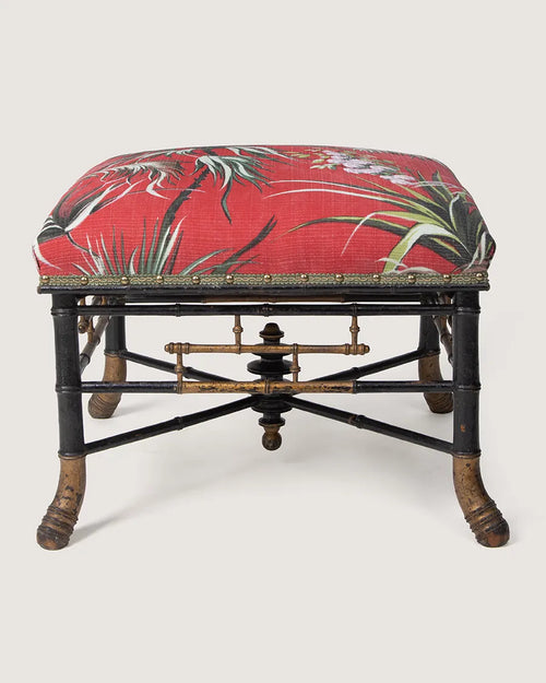 "The Emperor’s Tropical Dream" – an antique French Napoleon III faux bamboo ottoman upholstered in a rich 1950s tropical textile. One-of-a-kind vintage furniture curated by Atelier Bellinzona.