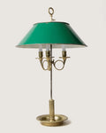 Magnificent late 19th-century French brass Bouillotte table lamp featuring an elegant, classic green metal shade.