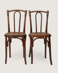 Pair of antique 1920s bentwood bistro chairs in the classic Thonet style, showing a beautifully weathered rich wood patina.