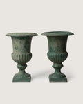 Pair of late 19th-century antique French cast iron Medici urns showing a stunning verdigris weathered patina.