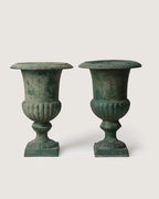 Pair of late 19th-century antique French cast iron Medici urns showing a stunning verdigris weathered patina.