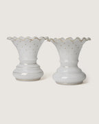 Stunning pair of late 19th-century French white opaline glass vases adorned with delicate gilded gold stars.