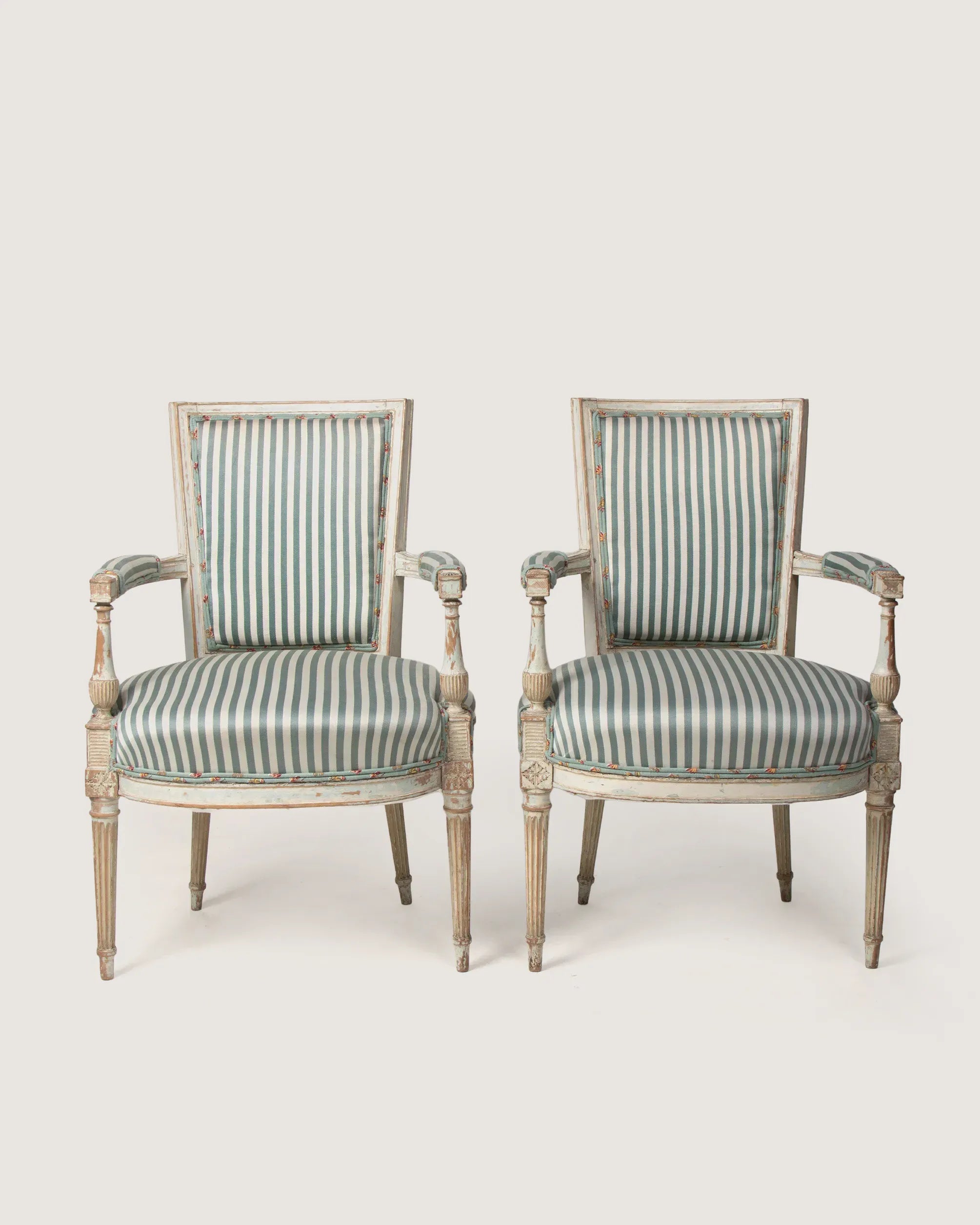 Late 19th-century pair of French Louis XVI style armchairs upholstered in rare vintage 1950s textiles.