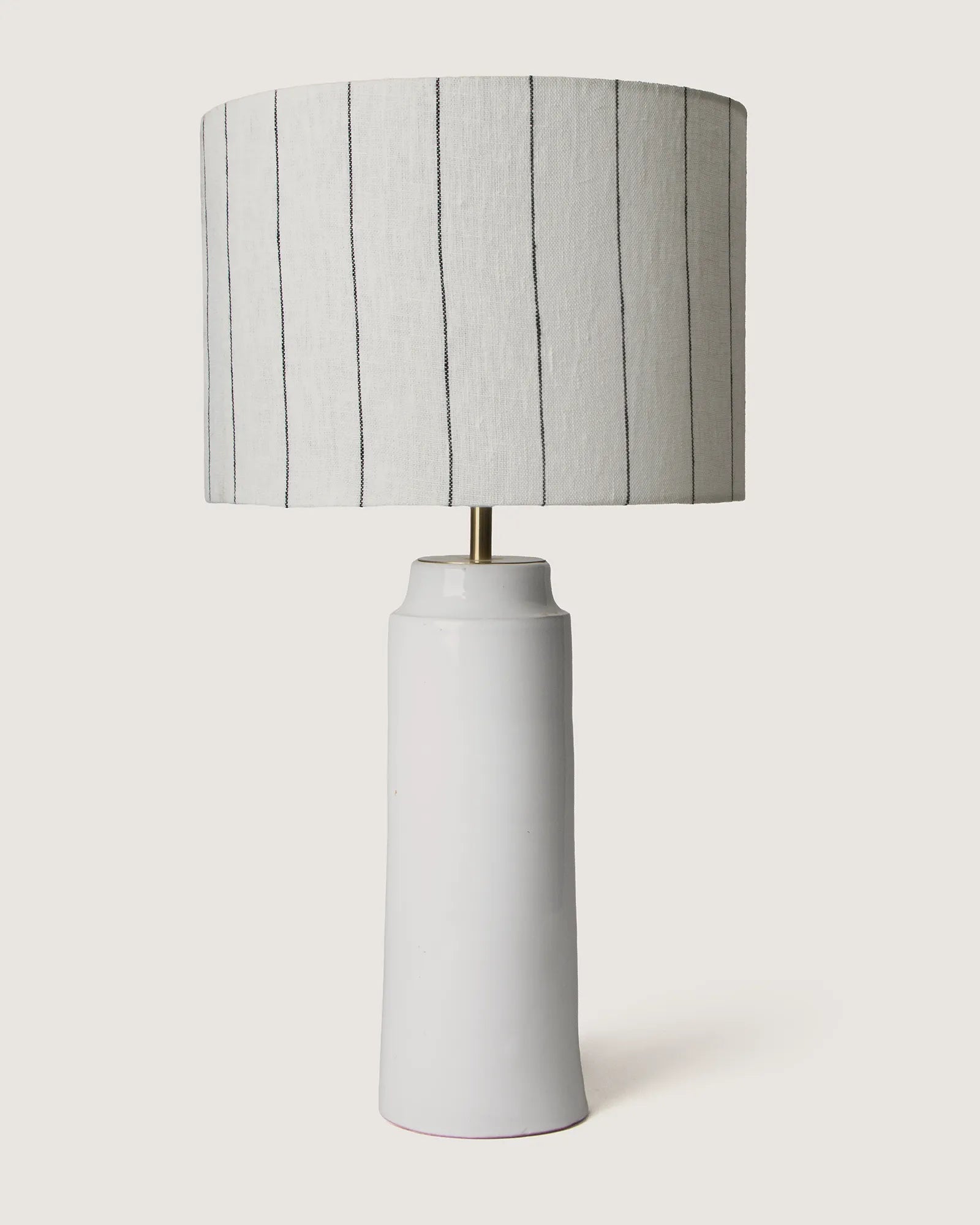 Pair of elegant white glazed Apulian ceramic table lamps complete with bespoke minimalist pinstripe fabric shades.