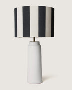 Pair of bespoke white glazed Apulian ceramic table lamps paired with graphic black and white striped shades.