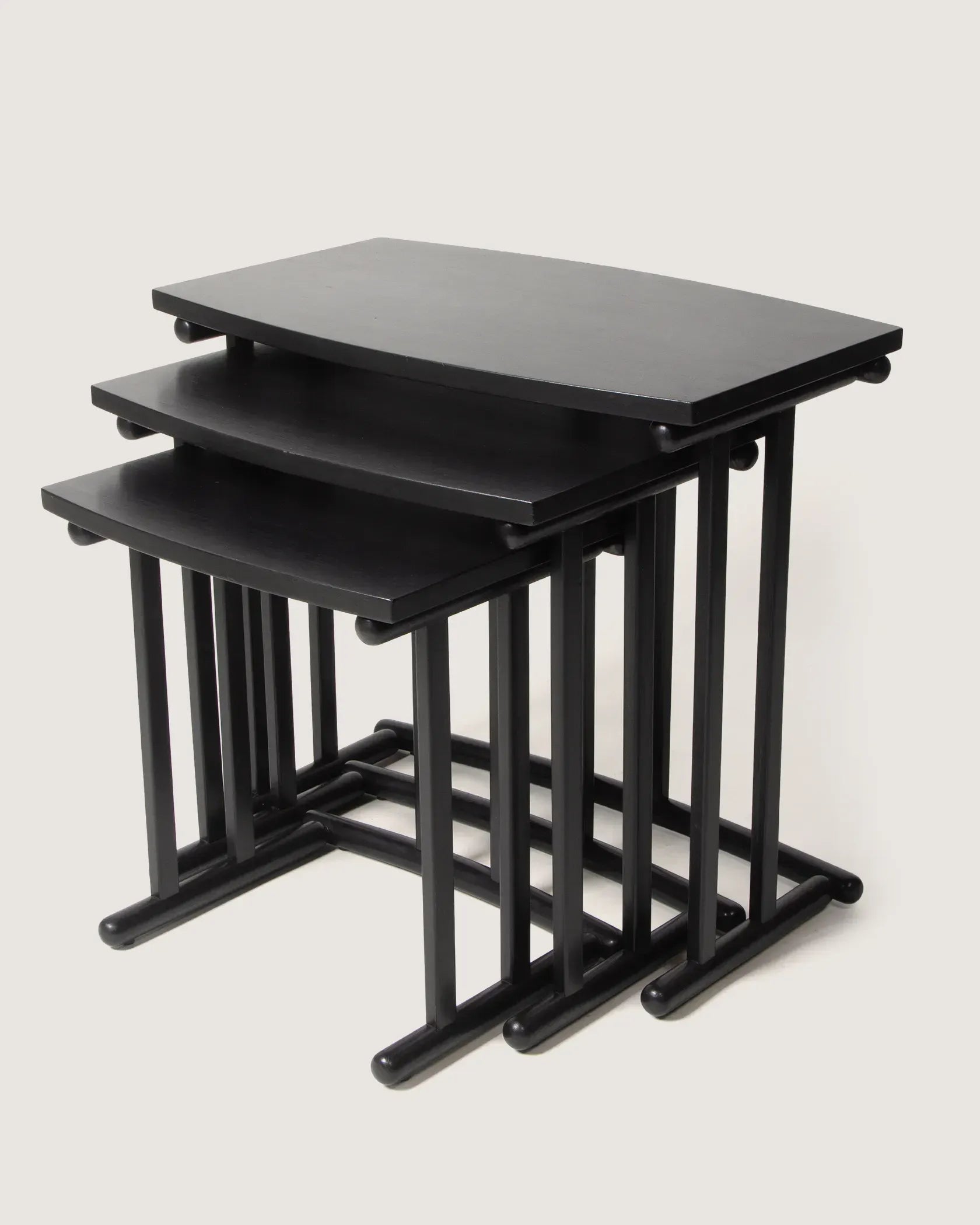 Set of three minimalist black nesting side tables from the 1980s with sleek architectural lines.
