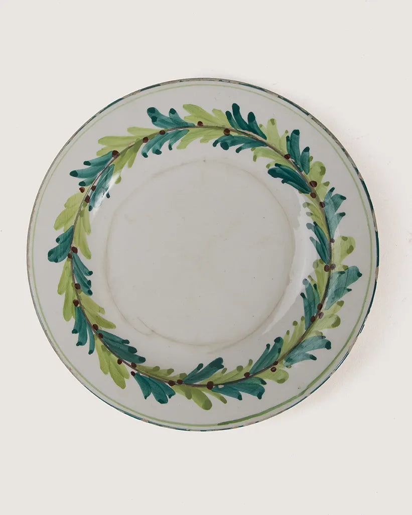 Set of six vintage Italian majolica ceramic plates hand-painted with green floral motifs, crafted in Bassano del Grappa, mid-20th century.