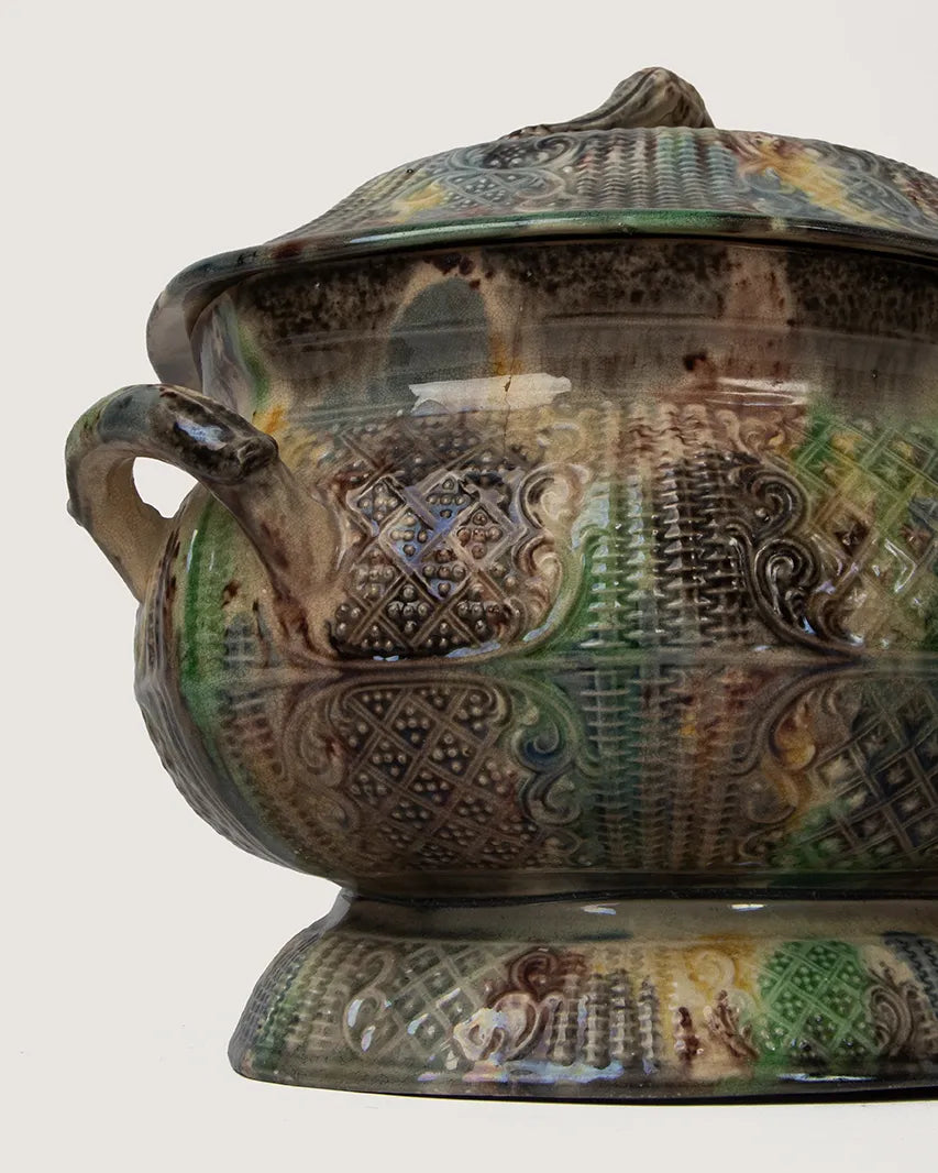 close-up of vibrant colored
glazes and intricate molded
detail on antique majolica