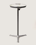 Vintage 1950s industrial barber shop washstand with a white metal frame, repurposed as an eclectic side table.
