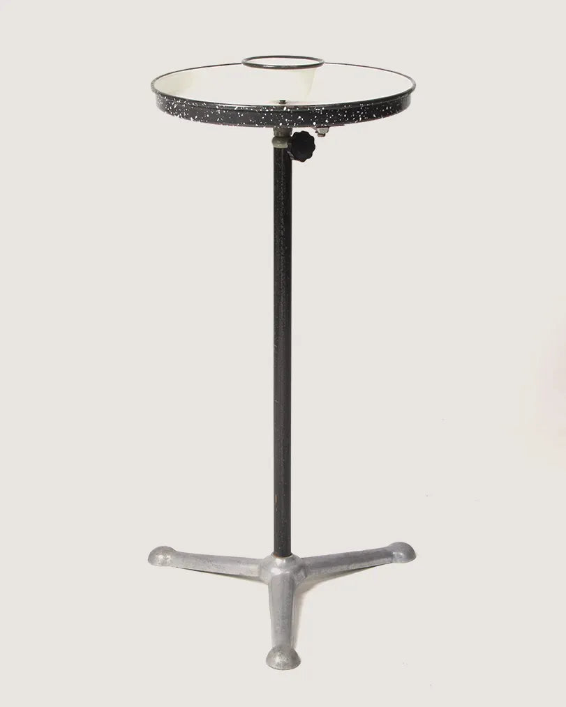 Vintage 1950s industrial barber shop washstand with a white metal frame, repurposed as an eclectic side table.