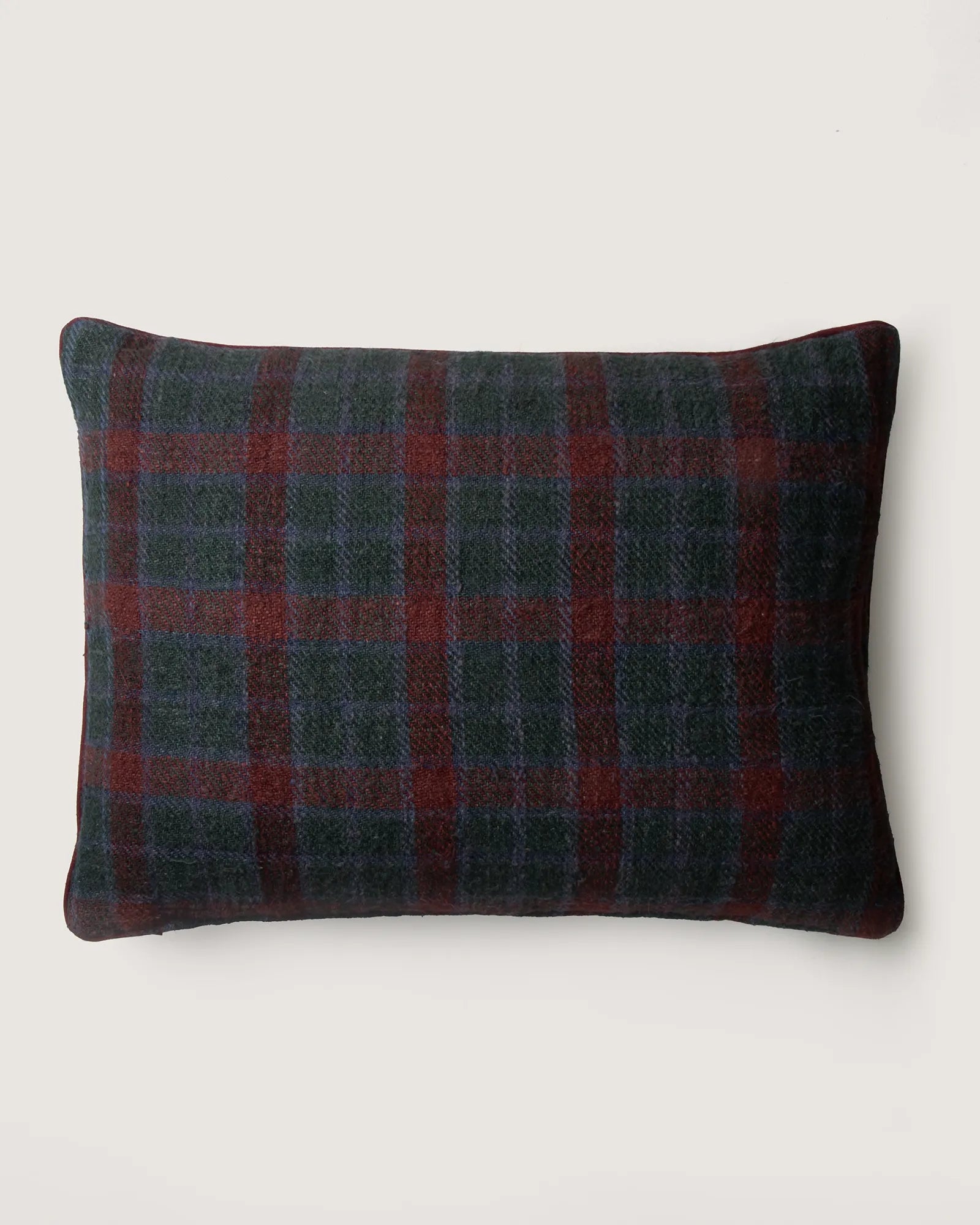 Vintage Eastern European lumbar cushion woven from rustic plaid cotton in warm, earthy tones.